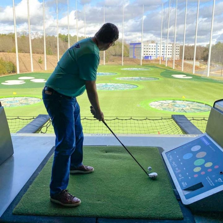 A dad is teed up to play at Top Golf Charlotte.