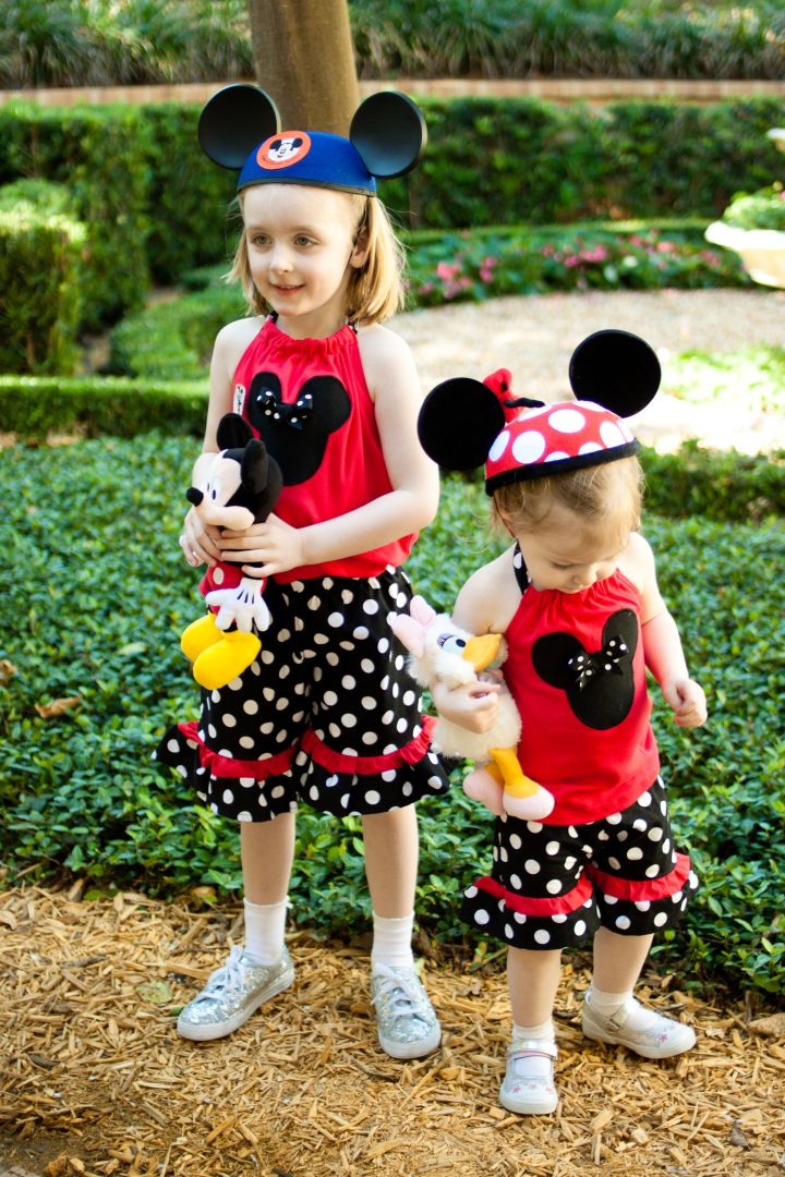 Two young girls, a toddler and a preschooler at Disney