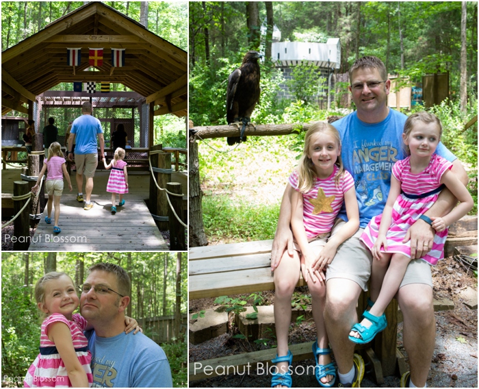 A dad and his two young girls visit the Carolina Raptor Center.