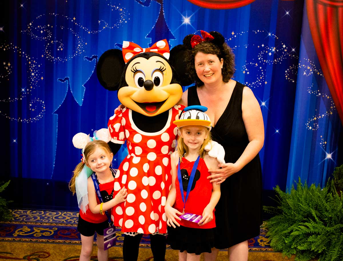 The girls pose with Minnie.