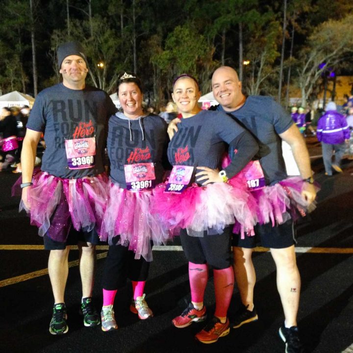 A running team all wearing pink tutus is ready to race for St. Jude.