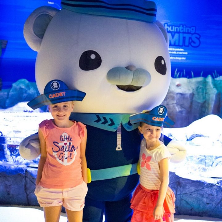 Two young girls post with an Octonauts character at Sea Life Aquarium.