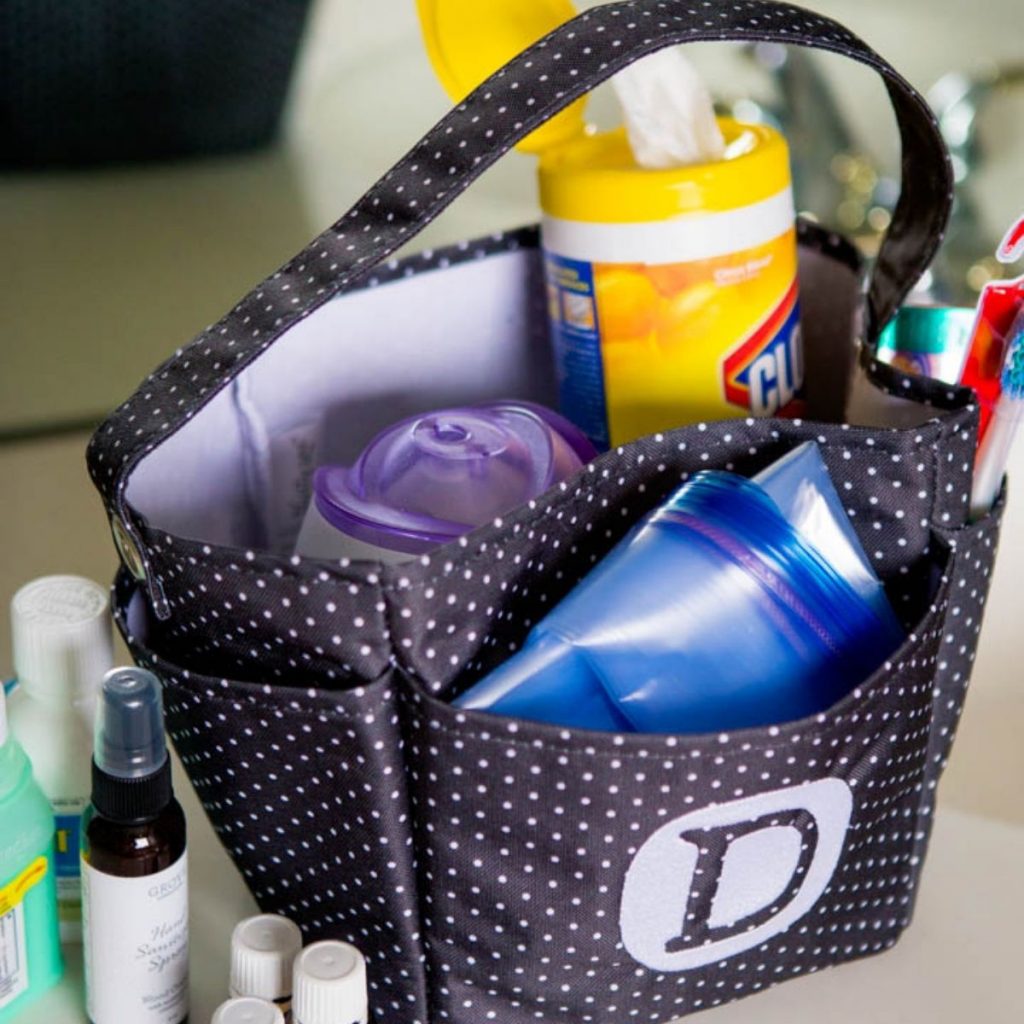 A basket of medicines and Clorox wipes for when a kid gets sick at Disney.