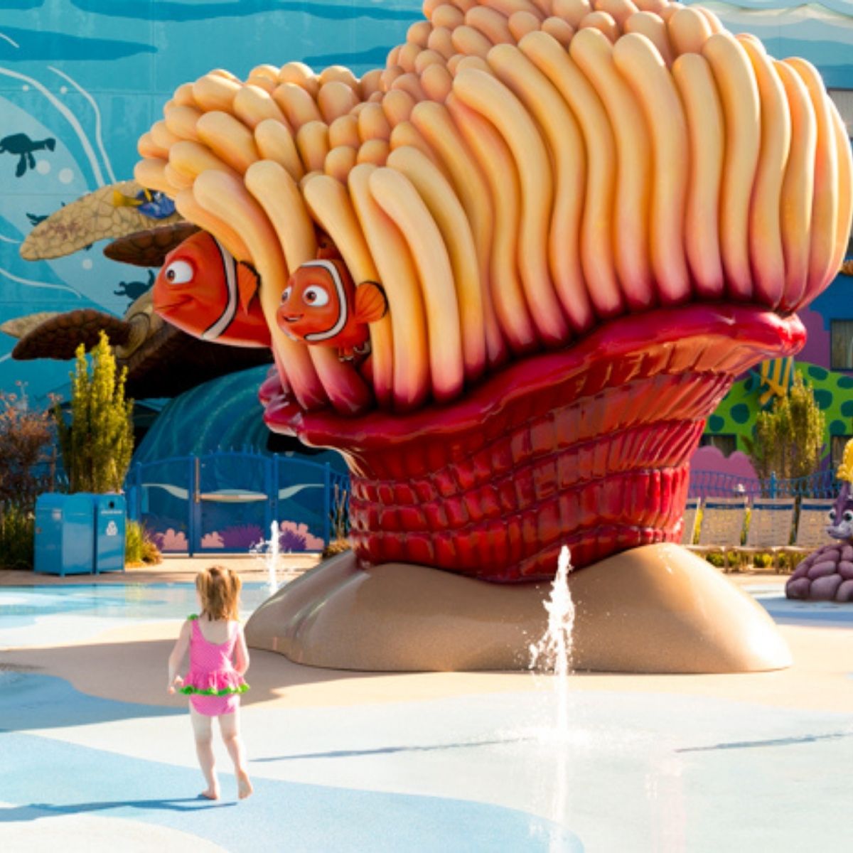 A young girl looks at the giant Nemo statue at the Art of Animation Resort in Walt Disney World.