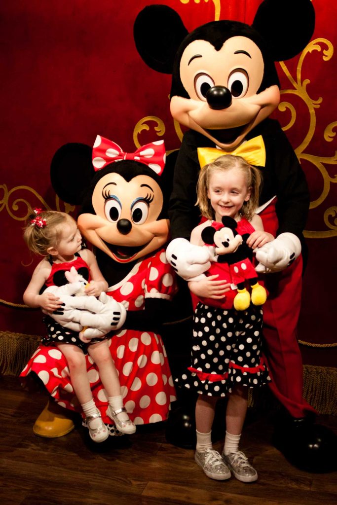 Two young girls meet Mickey & Minnie at their dressing room in Magic Kingdom.