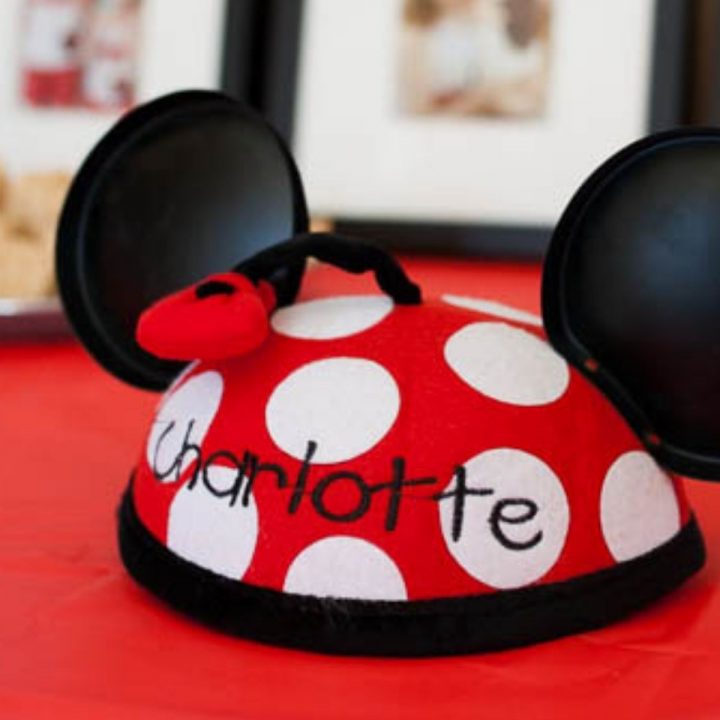 A red and white polka dot Disney Minnie Mouse Ear Hat.