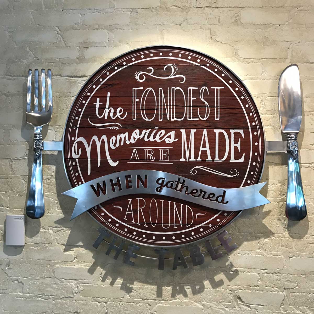 A sign on the wall at Metro Diner says "The fondest memories are made when granted around the table."