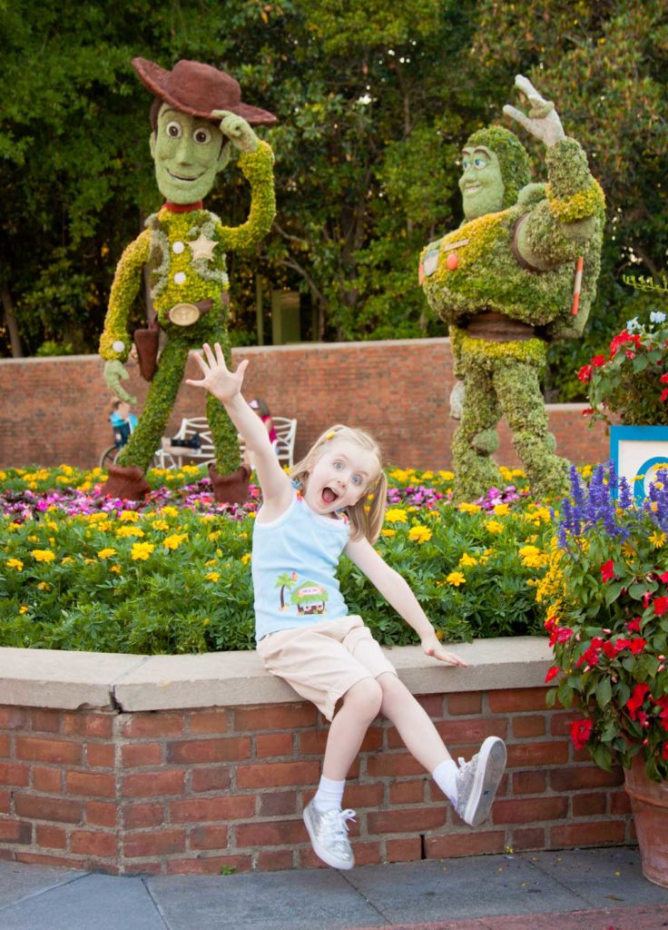 A silly pose in front of two topiaries at Epcot's Annual Garden festival.