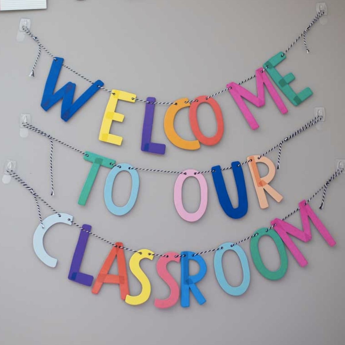 Welcome to our Classroom sign is hanging on the wall.
