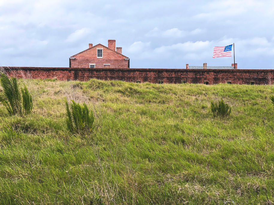 The historical center and flag at Fort Clinch are up on a hill in the background.