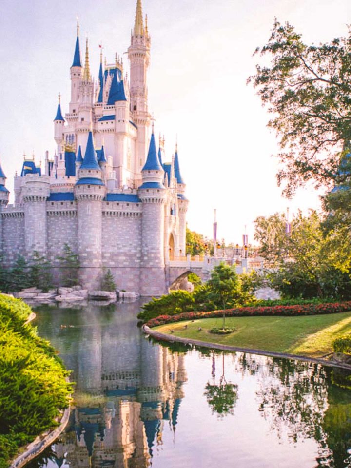 The Disney castle with a river passing by on the side.
