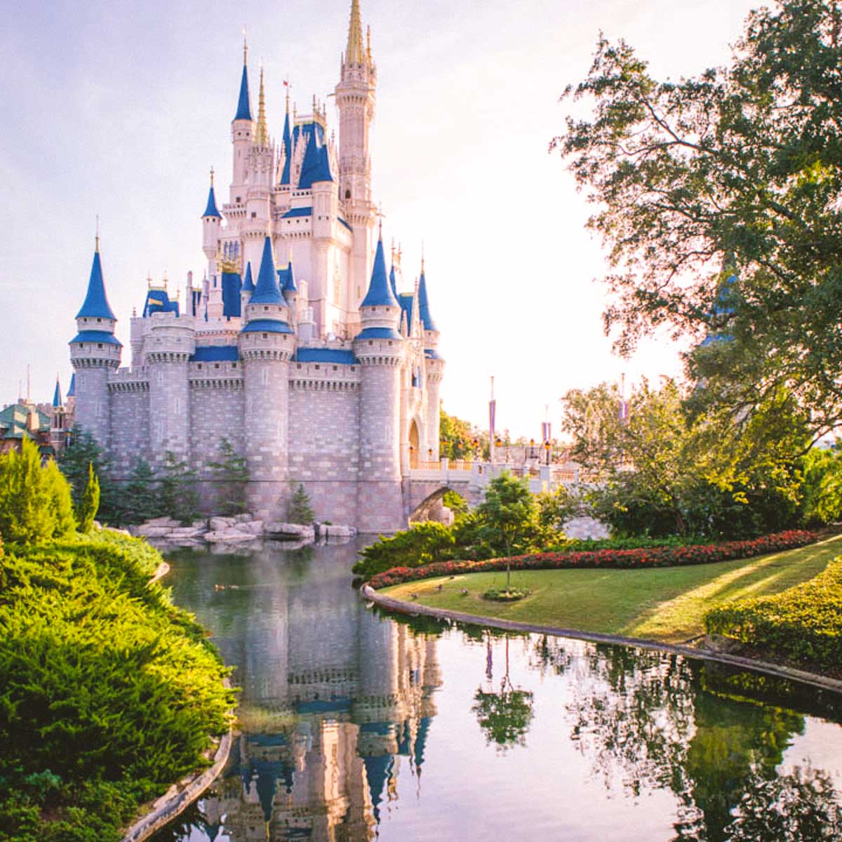 The Disney castle with a river passing by on the side.