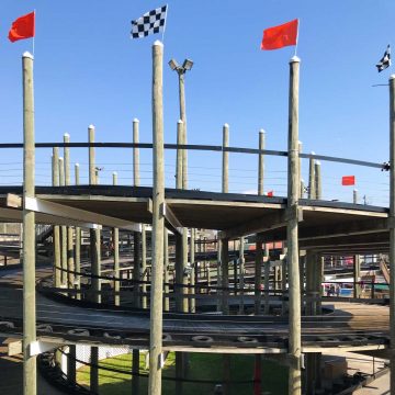 A go kart track with checkered flags at The Track in Pigeon Forge