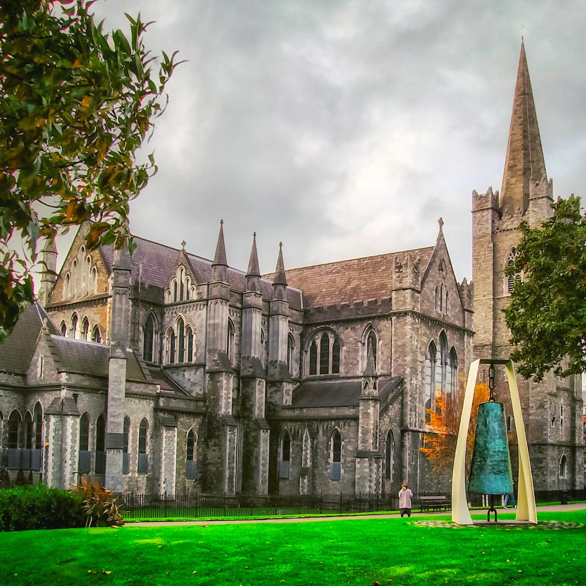 The outside of St. Patrick's Cathedral and a green lawn.