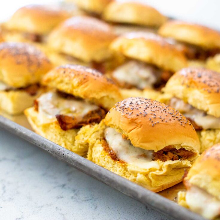 A pan of bbq chicken sliders started with slowcooker chicken.