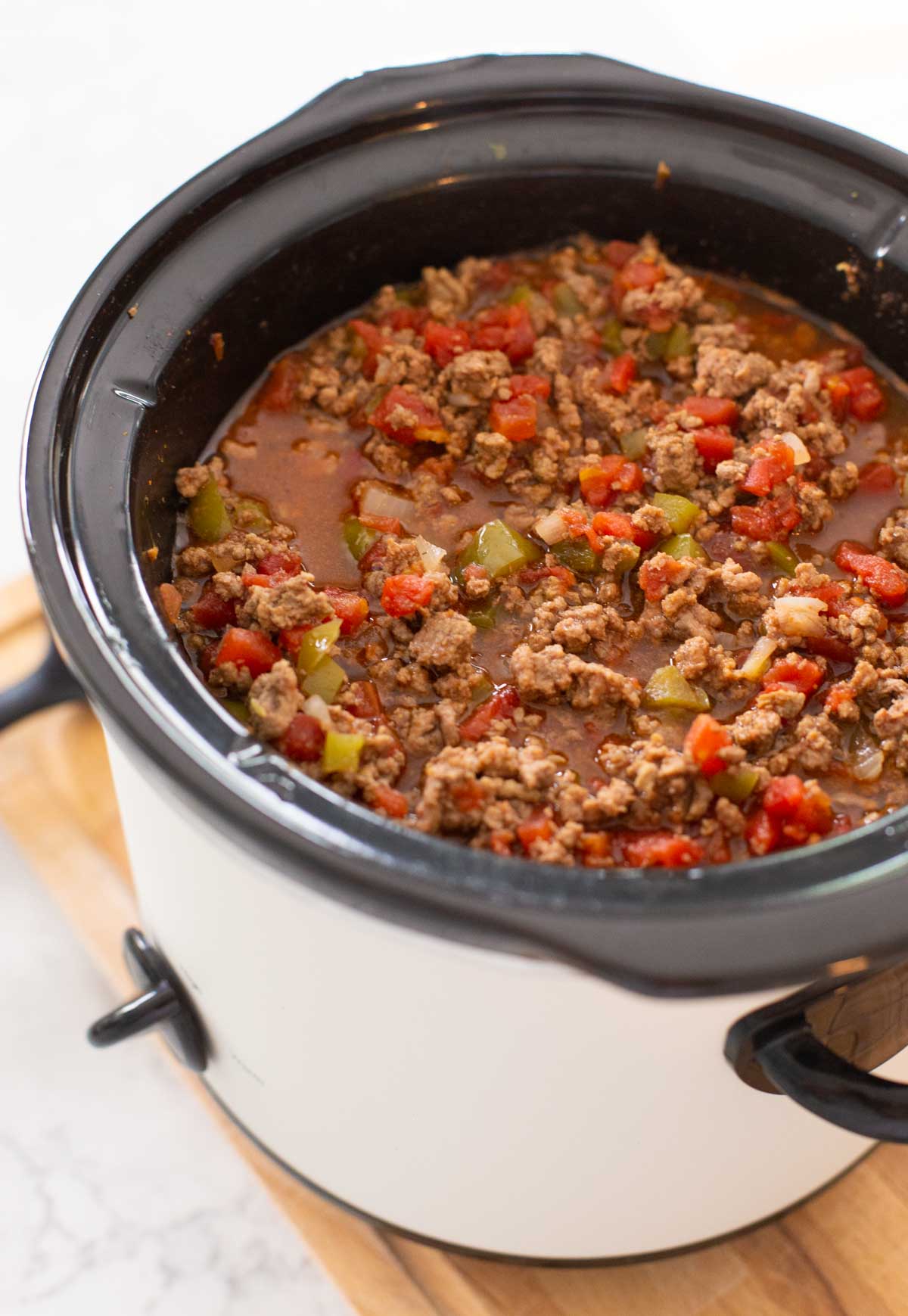 A slowcooker is filled with sloppy joe filling.