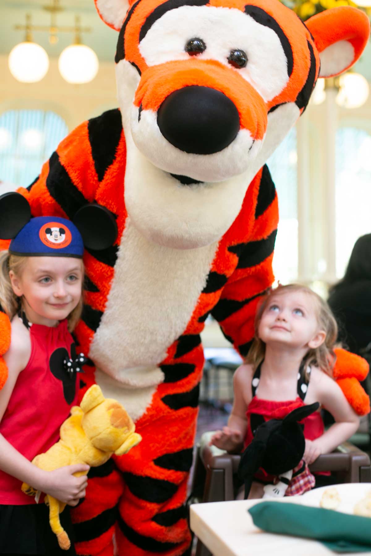 Tigger with two young girls.