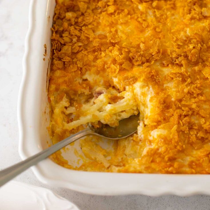 Cheesy potatoes with crispy cornflakes on top.