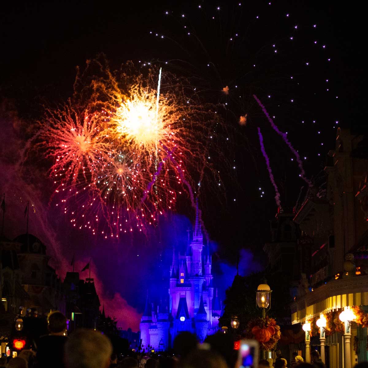 Fireworks are going off above Cinderella's Castle in Magic Kingdom.
