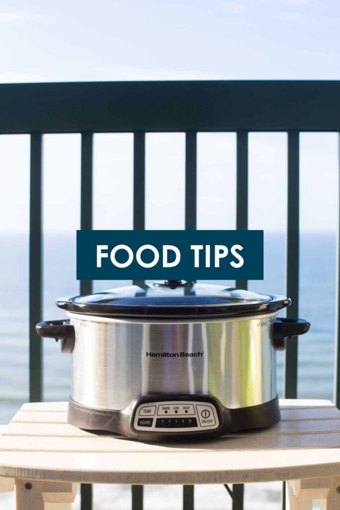 A slowcooker on the beach patio says "Food Tips" on it.