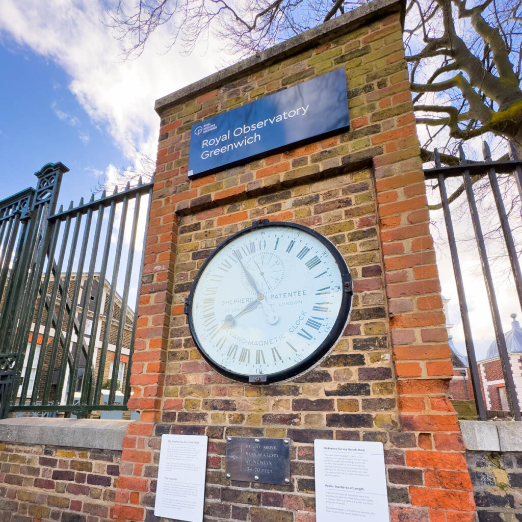 The clock on a brick pillar outside the observatory.