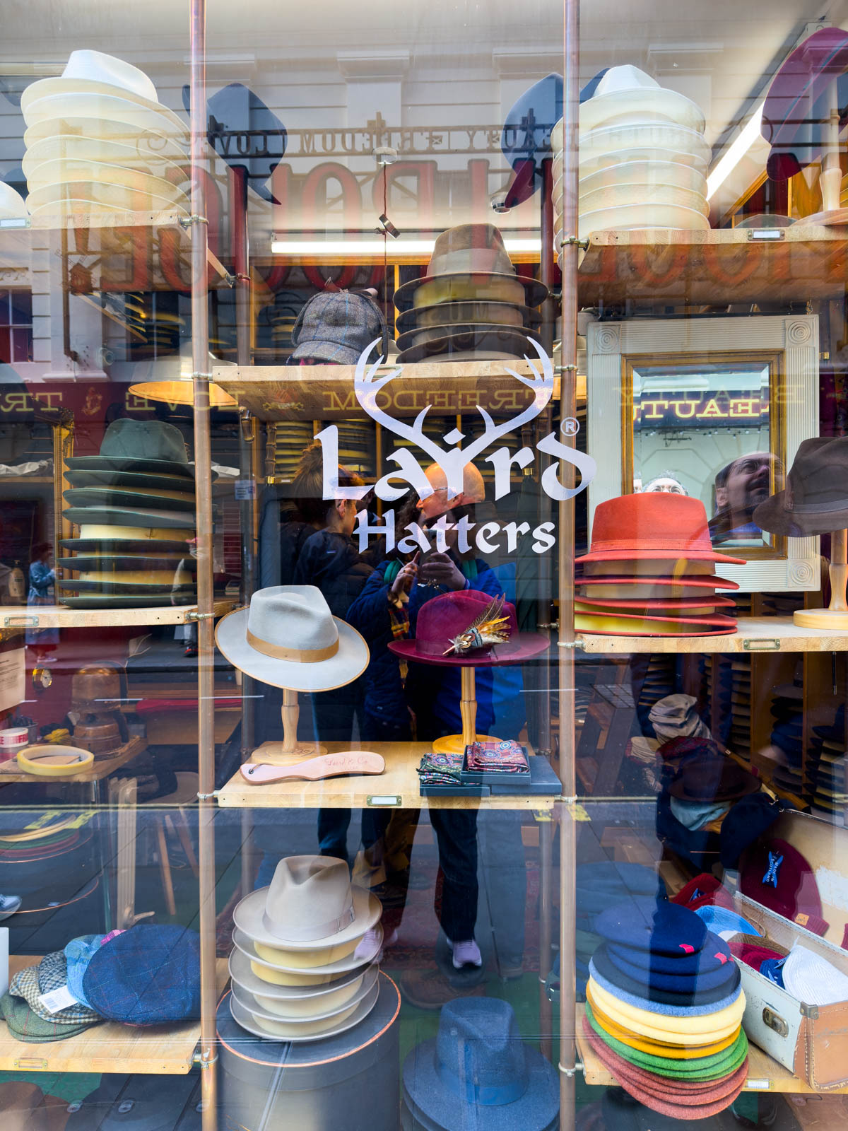 The outside of the hat shop.