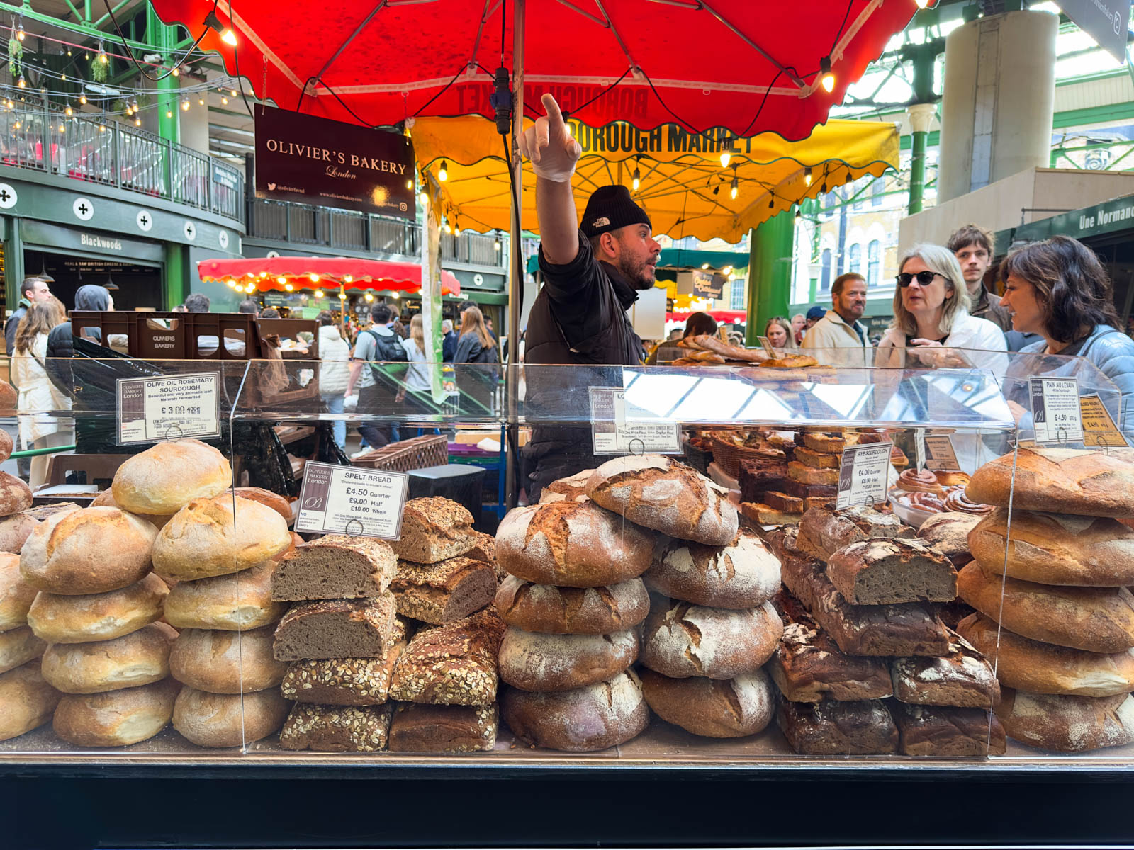 A food stall filled with breads at Borough Market.