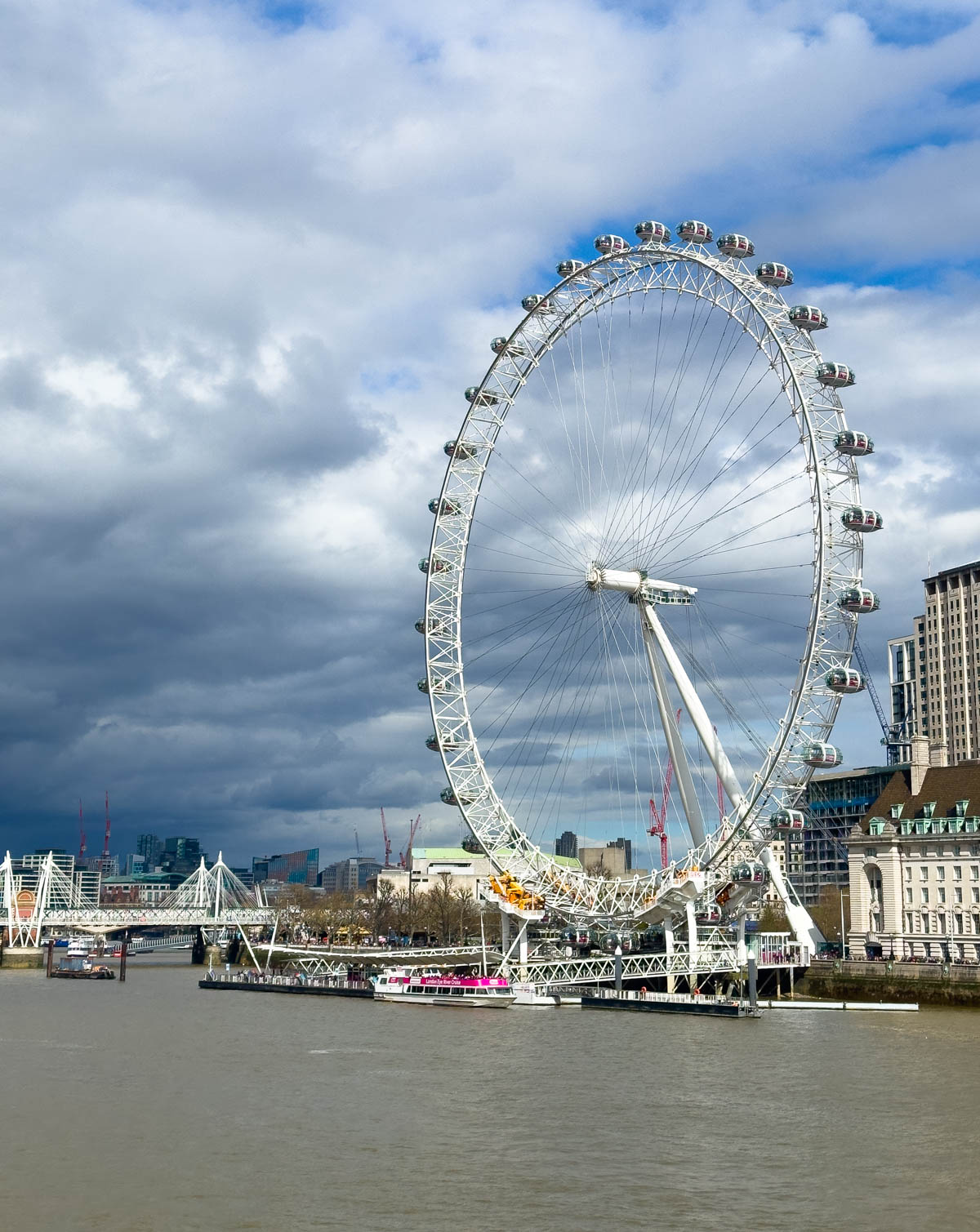 The London Eye ferris wheel on the river. 