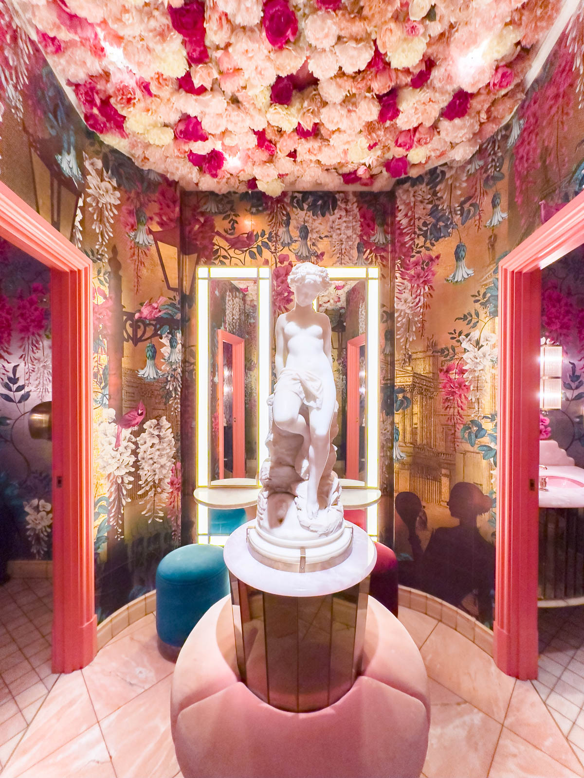 The Ivy bathroom is pink and covered in flowers.