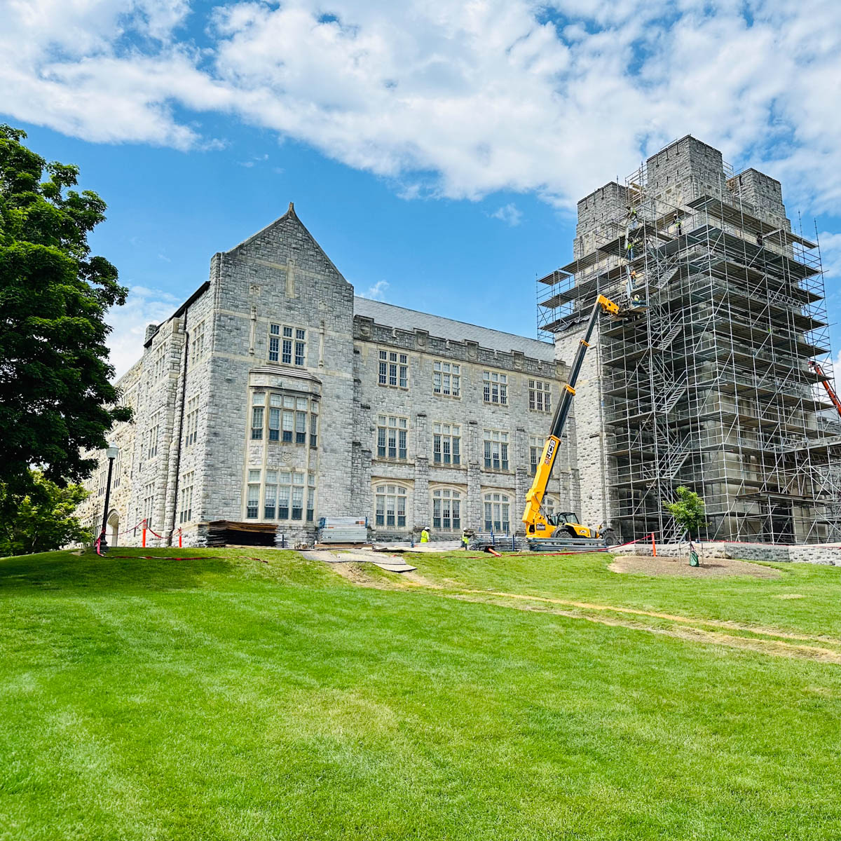 The outside of Burruss Hall is covered in scaffolding as it undergoes a surface update.