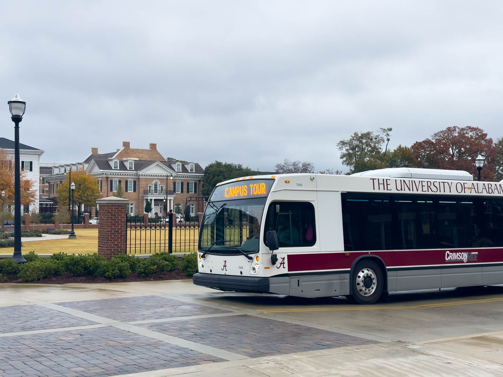 The Alabama tour bus in front of Greek Row.