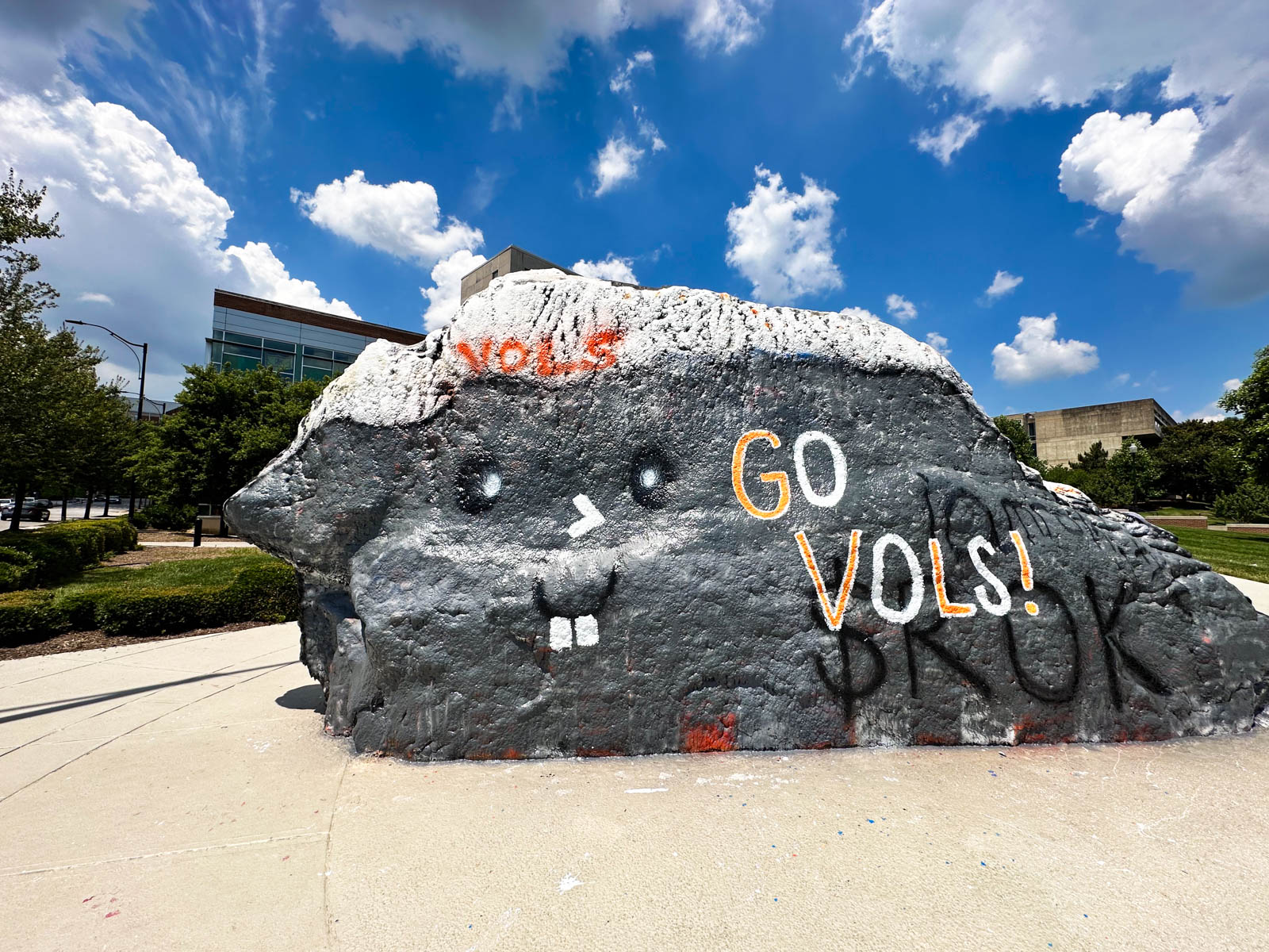 The enormous painted rock on the UT campus says "Go Vols!"