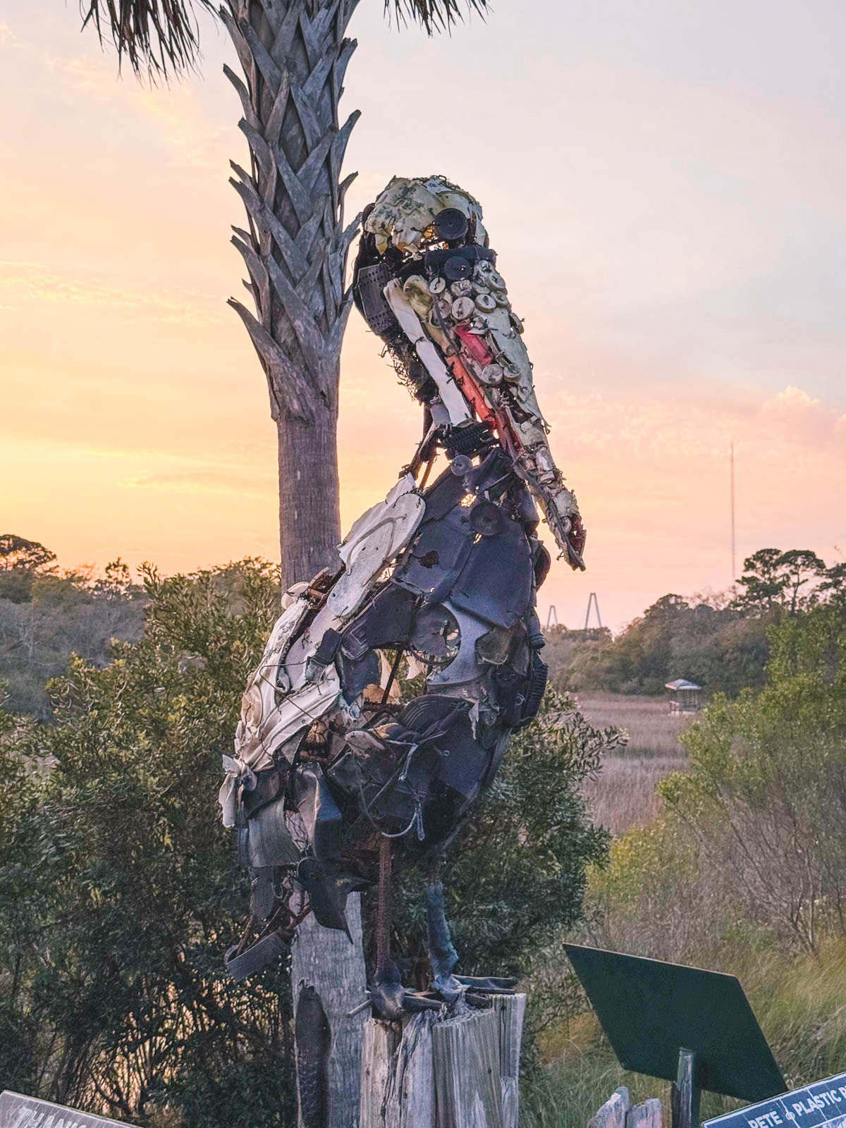 An environmental statue made from plastic trash from the water turned into a pelican.