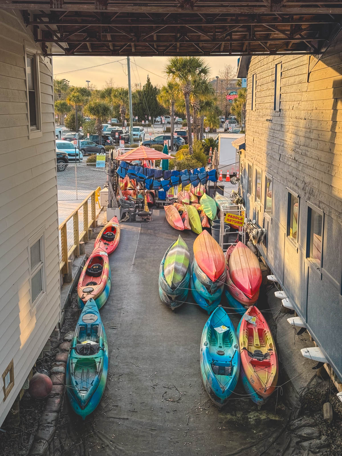 The kayaks are in storage alongside Shem Creek.